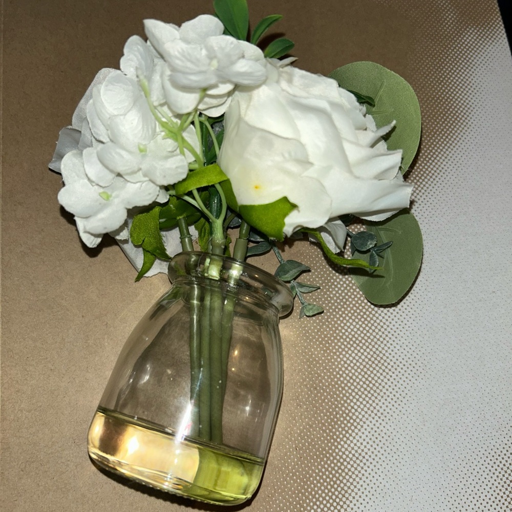 8 small artificial flower vases in water